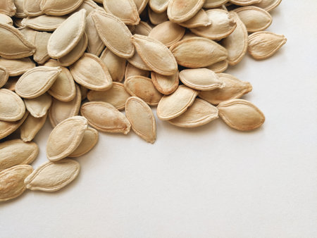 Pumpkin seeds on a white background. Close-up.の写真素材