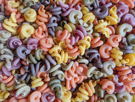 Colorful pasta background. Close up of multicolored pasta.