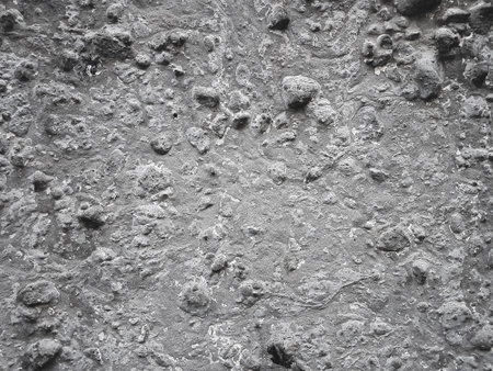 Texture of a concrete wall with scratches and cracks. Abstract background for design.