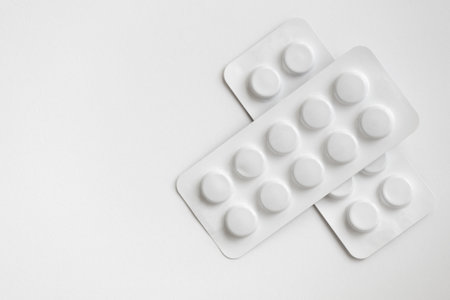 Tablets in blister packs isolated on white background. Top view.の写真素材