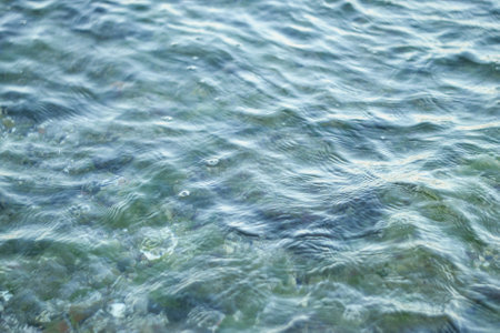 Blue sea water with ripples close-up. Natural background.