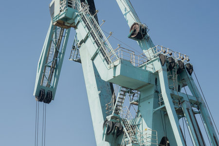 Detail of a port crane against the blue sky with copy spaceの写真素材