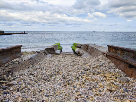 Old rusty ships on the beach of the Baltic Sea in Poland.の写真素材