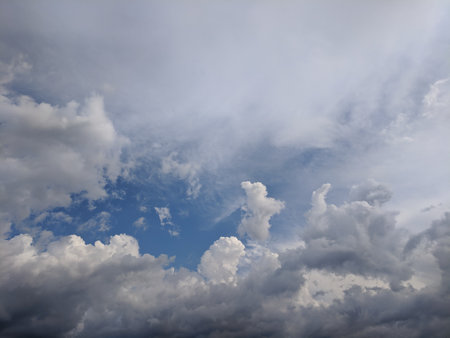 Blue sky background with white clouds. Cumulus white clouds in the blue sky.