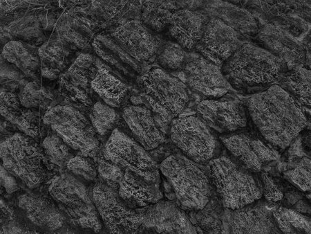 black and white image of stone wall texture for background. High quality photoの写真素材