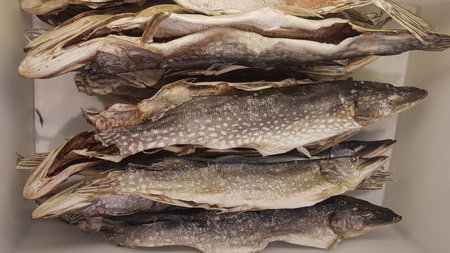 Close up view of a pile of dried fish in a supermarket.の写真素材