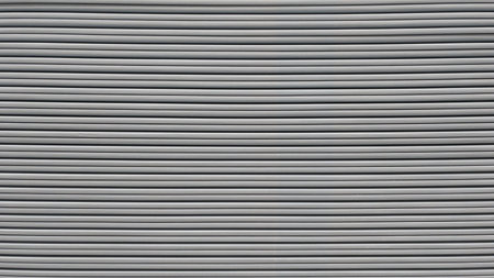 Close-up of corrugated metal sheet texture. Industrial backgroundの写真素材