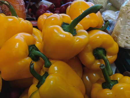 Yellow peppers on the counter of a supermarket. Vegetables and fruits.の写真素材