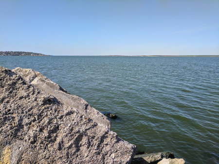 Rocky shore of Lake Balaton, Hungary in a sunny dayの写真素材