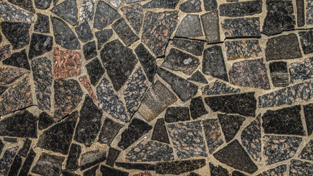 Texture, background. The pavement of granite. Granite cobblestones