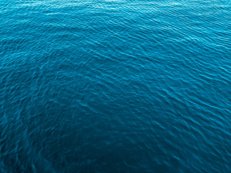 Blue sea water surface texture background. Close up view of rippled water surface.の写真素材