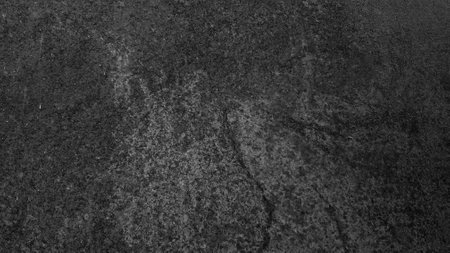 Dark gray black slate background or texture. Close up of black stone surface.の写真素材