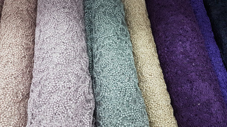 Close up of a stack of multicolored towels in a storeの写真素材