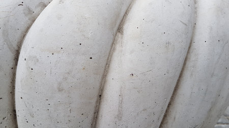 Detail of a marble sculpture in a park in Paris, France