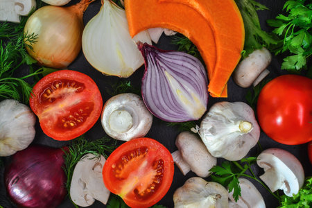 Fresh vegetables on a black background, top view, close-upの写真素材