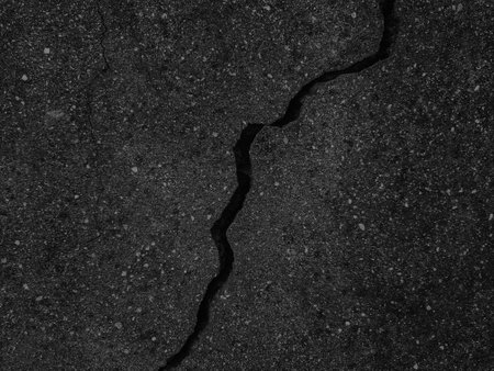 Cracks in the asphalt as a background. Texture, pattern.の写真素材