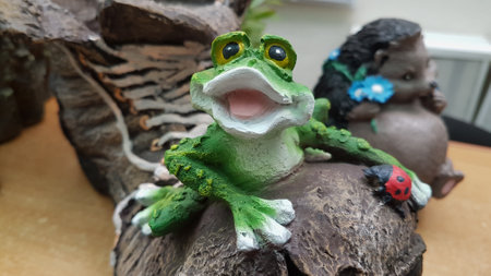 Cute frog made from plasticine on wooden background, close upの写真素材