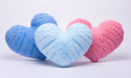 Colorful knitted hearts on a white background. Valentine's Day.の素材