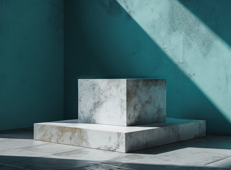 White marble pedestal with shadow on blue wall. 3D renderingの素材