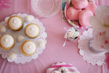 pink table top view with sweets candies