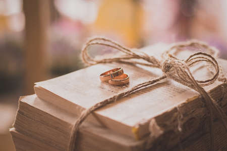 engagement wedding rings with book backgroundの写真素材