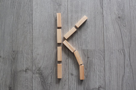 letter K with wooden natural blocks, construction, game for kids, no stress with wooden blocks, backgroundの写真素材