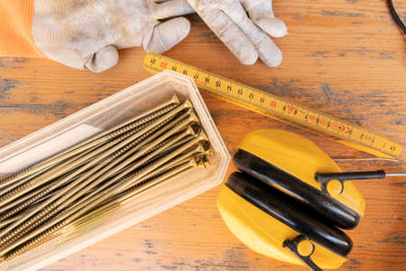 set of construction tools on a wooden background top viewの写真素材