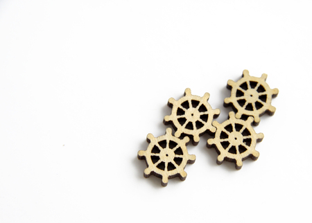 laser cutting wooden gears on a white backgroundの写真素材