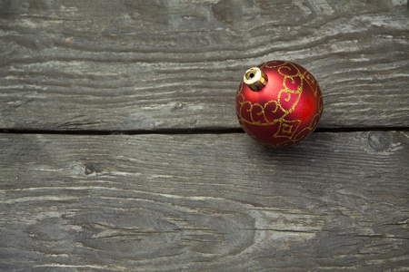 small different Christmas gift boxes on a rustic wooden backgroundの写真素材