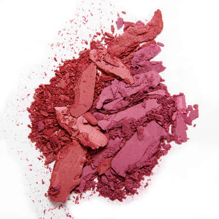 crumbled red pink eyeshadow and blush isolated on white backgroundの写真素材
