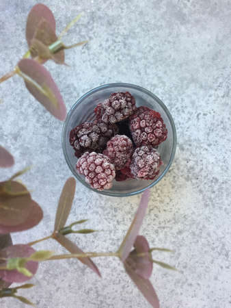 frozen blackberries in a glass