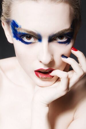 A blond woman with creative make upの写真素材