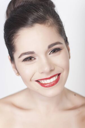 Beautiful Brunette Smiling Woman Portrait With Red Lipstickの写真素材