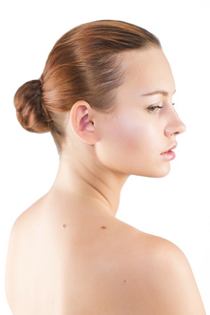 Brunette woman with natural make up with highlights isolatedの写真素材