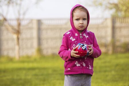Little girl kid playing, having fun. outdoors