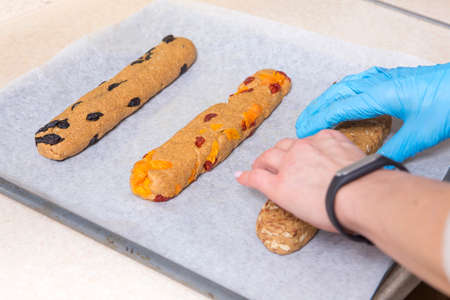 Prepatarion for homemade tasty biscotti with raisins and dried fruits. Italian traditional receipt....