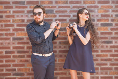 Happy caucasian family of mother and father on a walk in european city, dressed in casual outfit. Summer daylightの写真素材