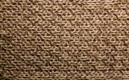 knitted beige texture closeup, background