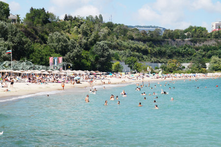 Varna, Bulgaria - July, 19, 2020: people sunbathe and swim on the sea beachのeditorial素材