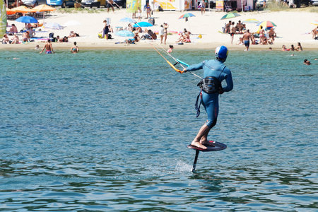 Varna, Bulgaria - July, 19, 2020: a man is kiting the sea against the background of the beachのeditorial素材