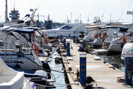 Varna, Bulgaria - August, 01,2020: white yachts moored in the port against the backdrop of the sunset skyのeditorial素材