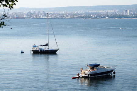 Varna, Bulgaria - September, 12, 2020: two yachts with people resting in the sea bay, aerial photoのeditorial素材