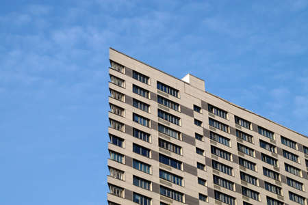 modern skyscraper on the background of the cloudy sky, copy space.