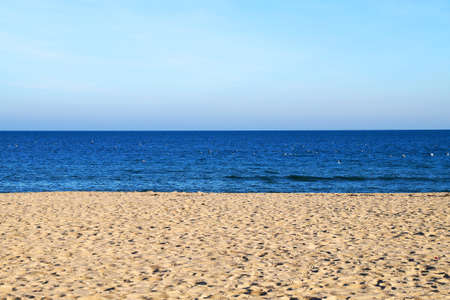 empty sandy beach, sea and clear blue sky, landscape for background