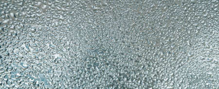 rain wet glass texture for background close-upの写真素材