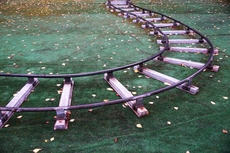 children's railway on artificial lawn in an autumn park.の写真素材