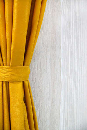 gold draped curtain and white light tulle, place for text, copy space.の写真素材