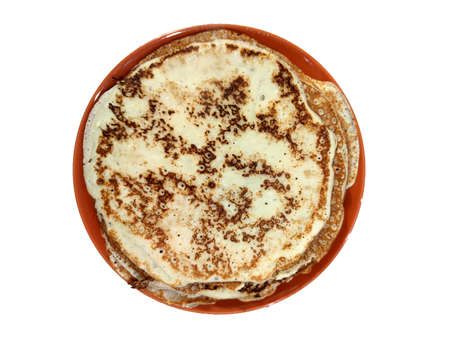 thin pancakes in a plate, top view, isolate on a white background.の写真素材
