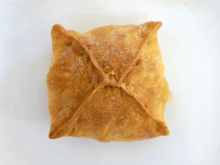 ruddy baked pie on white background close up, russian cuisine
