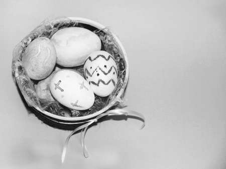 easter eggs in a decorated plate black and white photo, copy space.の写真素材
